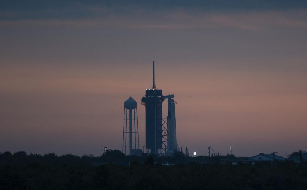 A SpaceX Falcon 9 rocket with the company's Crew Dragon spacecraft onboard is seen on the launch pad at Launch Complex 39A at sunrise as preparations continue for the Demo-2 mission, Wednesday, May 27, 2020, at NASA's Kennedy Space Center in Florida.