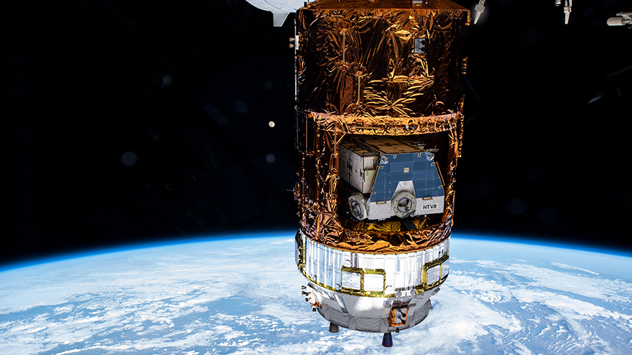 Japan's HTV-9 resupply ship is pictured dwarfing the Moon behind it