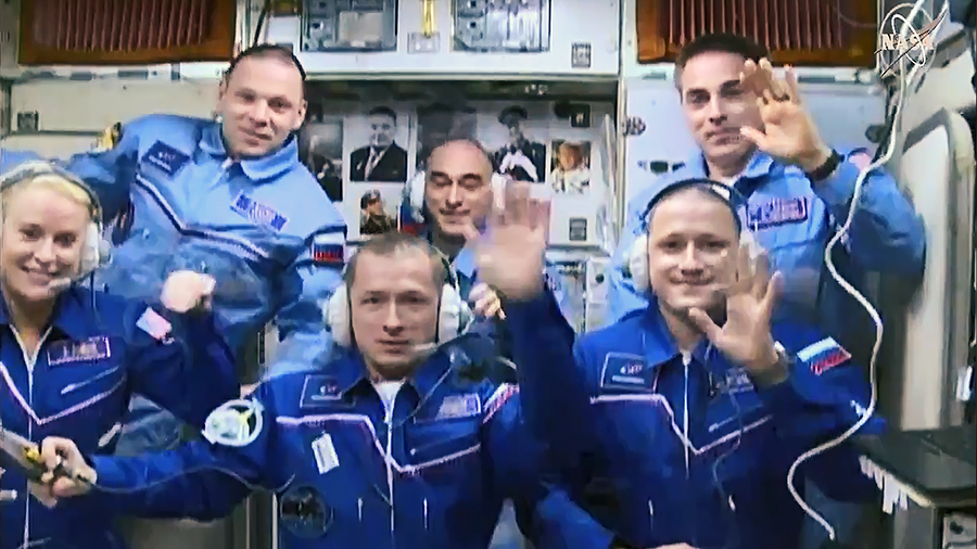 (Front row from left) Expedition 64 crew members Kate Rubins, Sergey Ryzhikov and Sergey Kud-Sverchkov join Expedition 63 crew members (back row from left) Ivan Vagner, Anatoly Ivanishin and Chris Cassidy inside the space station's Zvezda service module.