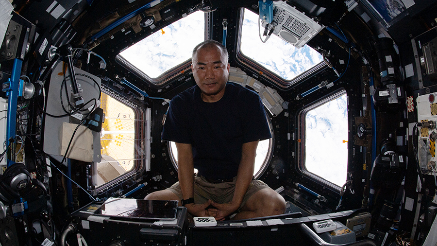 Expedition 64 Flight Engineer Soichi Noguchi is pictured relaxing at the end of the work day inside the seven-windowed cupola, the International Space Station's