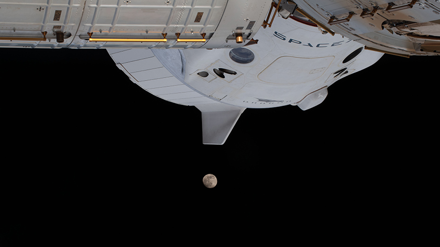 The moon is pictured below the SpaceX Crew Dragon spacecraft as the space station was orbited 263 miles above Atlanta, Georgia.