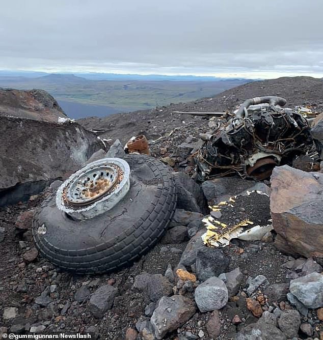 One of the aircraft's wheels and another part of its motor are strewn across the Icelandic mountainside