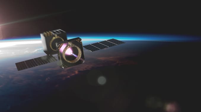 An artist's rendering of a Momentus Vigoride transfer vehicle deploying satellites in orbit.