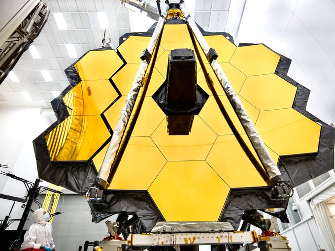 Close-up shot of the James Webb Space Telescope's primary mirror in its fully unfolded state, resembling a golden honeycomb.