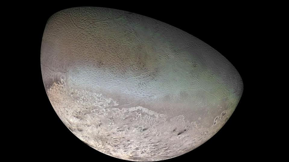 This global color mosaic shows Neptune's largest moon, Triton. Pink-hued methane ice may compose a massive polar cap on the moon's surface, while dark streaks overlaying this ice is thought to be dust deposited from huge geyser-like plumes that erupt from Triton's surface. -16