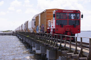 A train transporting the 10 booster segments for NASA's Space Launch System rocket