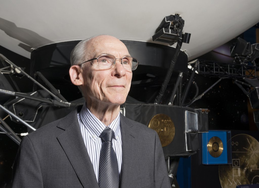 Ed Stone in 2019, in front of a scale-model of the Voyager spacecraft at NASA's Jet Propulsion Laboratory.