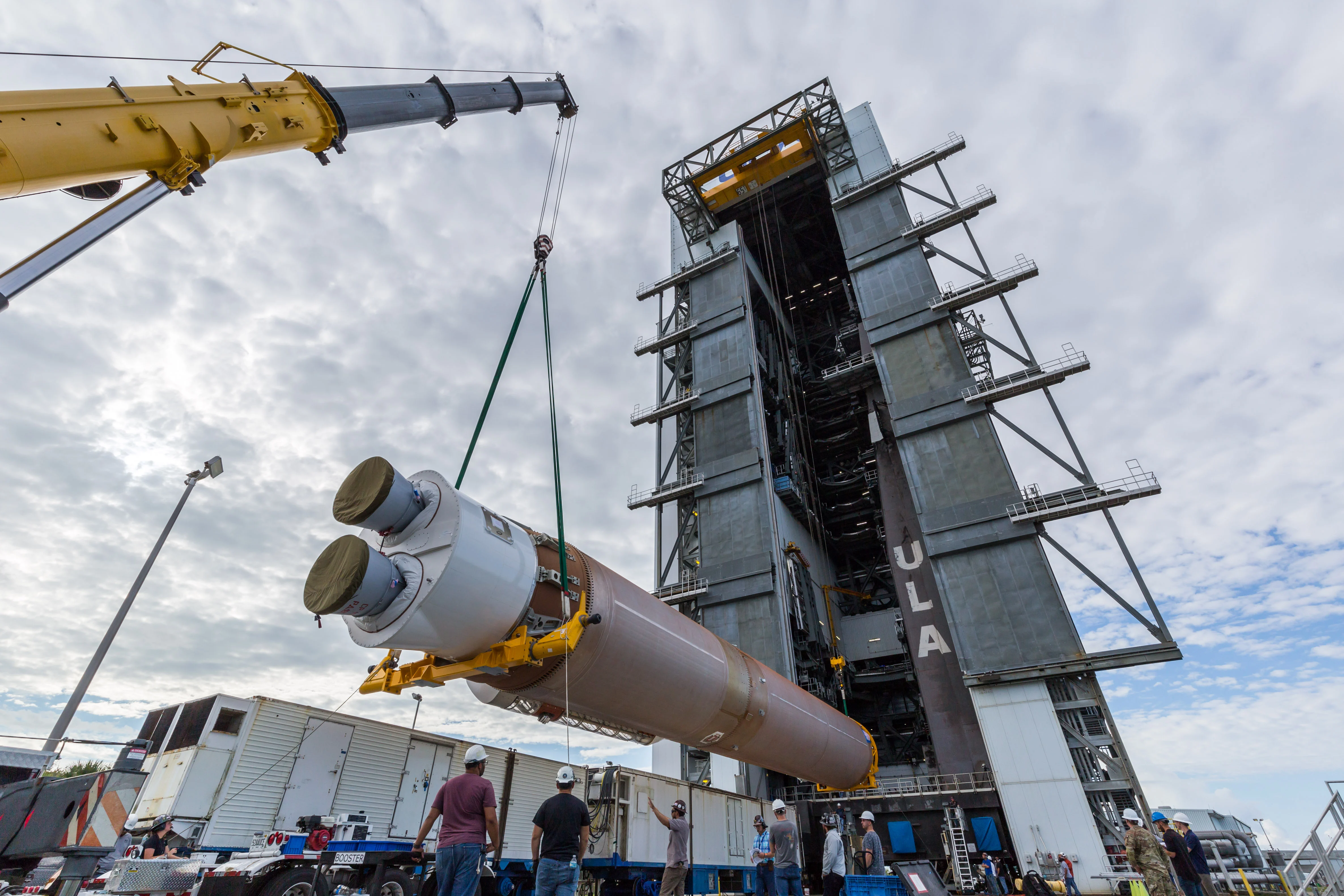 The Atlas V is lifted up by cranes to move the breakover fixture into position. Photo by United Launch Alliance