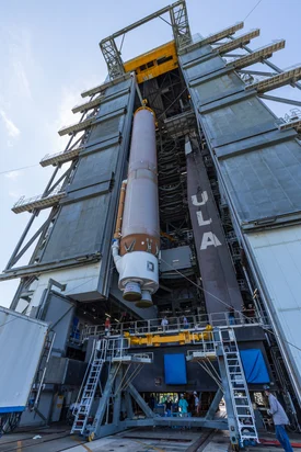The VIF crane moves Atlas V into the building. Photo by United Launch Alliance