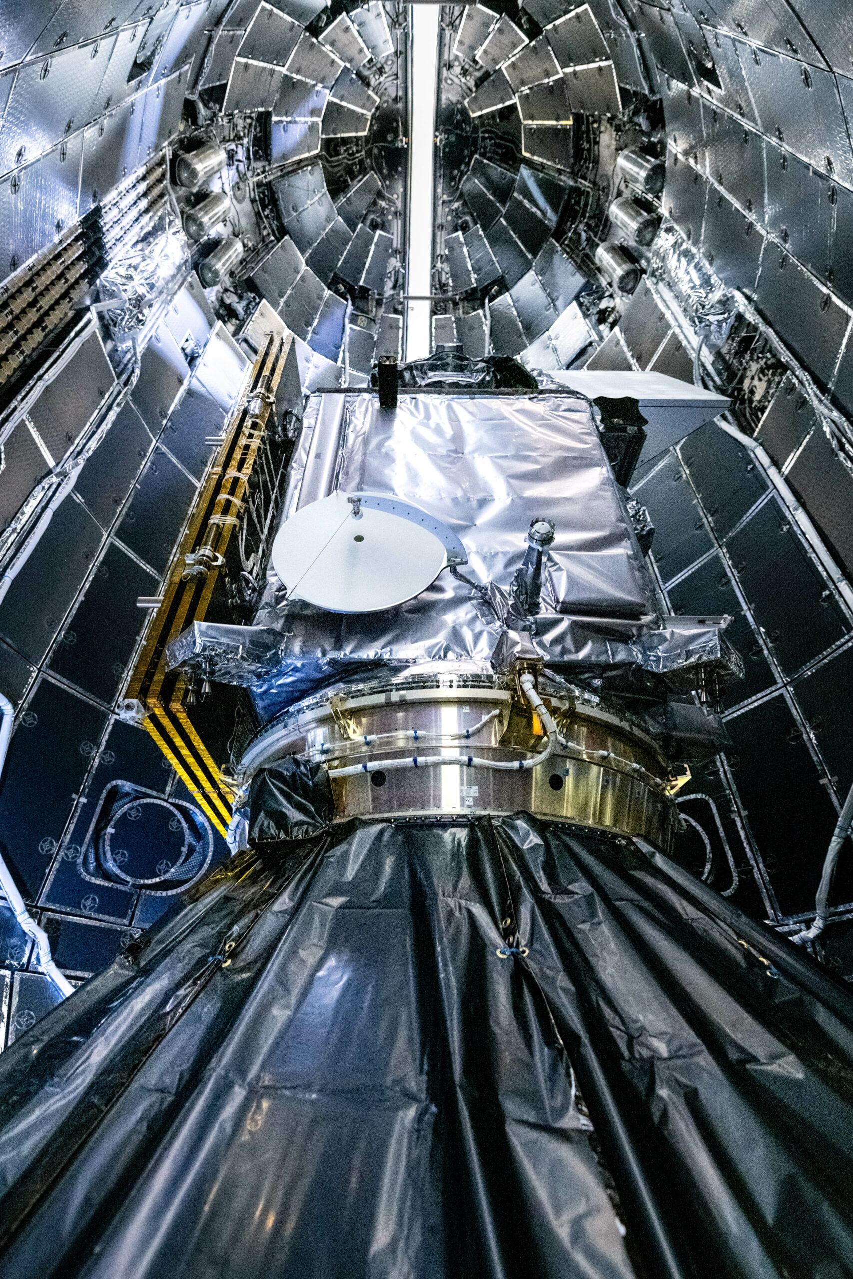 NASA's PACE spacecraft encapsulated in SpaceX Falcon 9 payload fairing halves.
